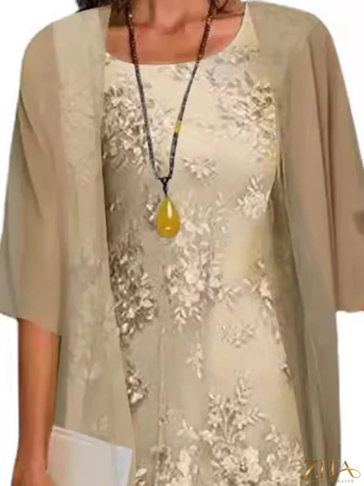 Plus size elegant lace overlay dress with matching chiffon cardigan by Zita La Belle Elite, shown on a model.