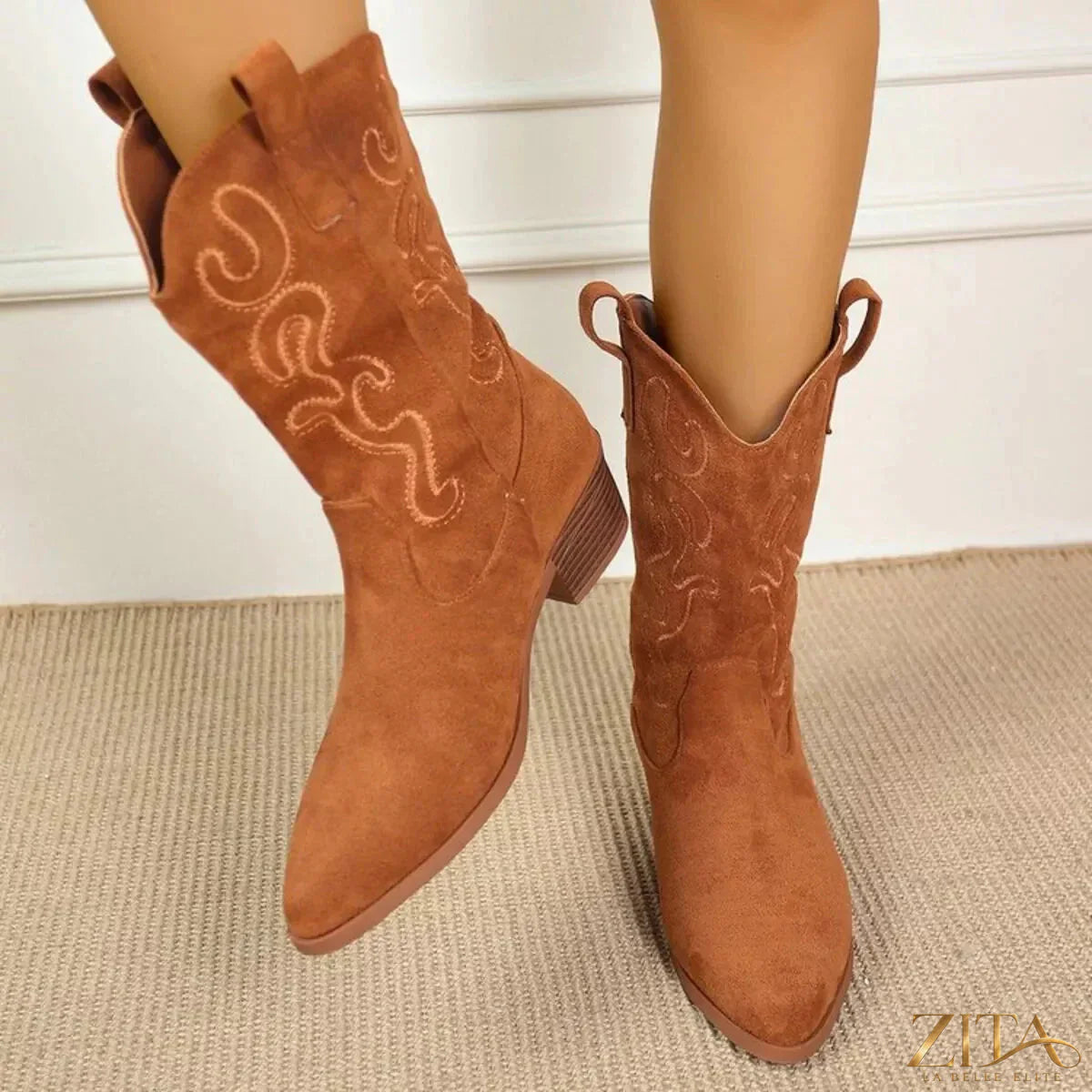 Zita La Belle Elite point toe block heels boots with sleek design and stylish silhouette, shown in black on a model.