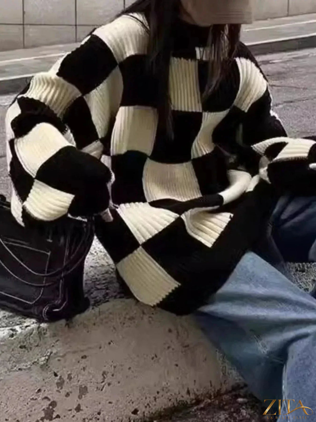 Zita La Belle Elite oversized sweater with black and white checkerboard pattern, cozy knit fabric, and relaxed fit.