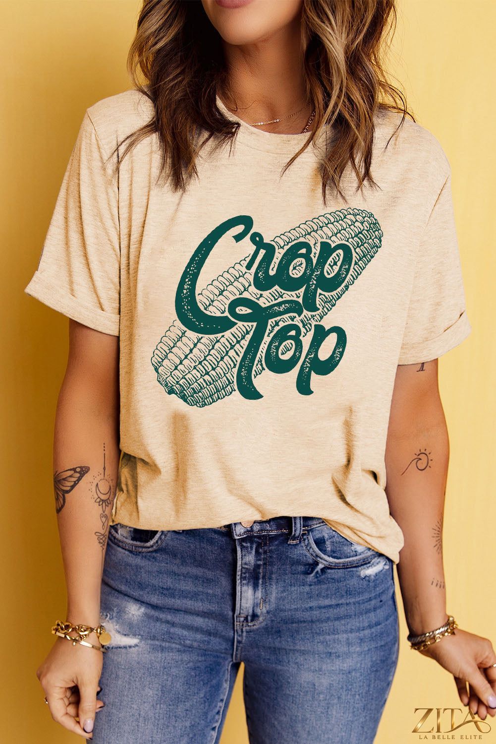 Black Corn Letter graphic cuffed T-shirt by Trendsi featuring bold corn-themed print and comfortable cuffed sleeves.
