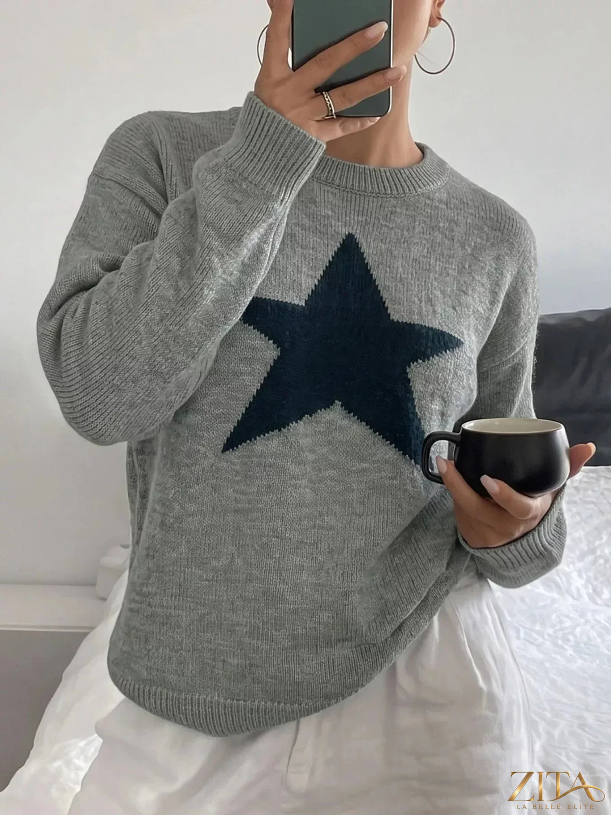 Star-patterned dropped shoulder sweater by Zita La Belle Elite, showing the cozy knit with star designs and relaxed fit.