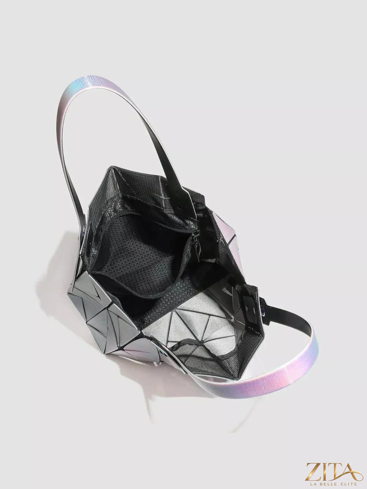 Iridescent geometric shoulder bag by Zita La Belle Elite featuring a modern, angular design with shiny, reflective surface.