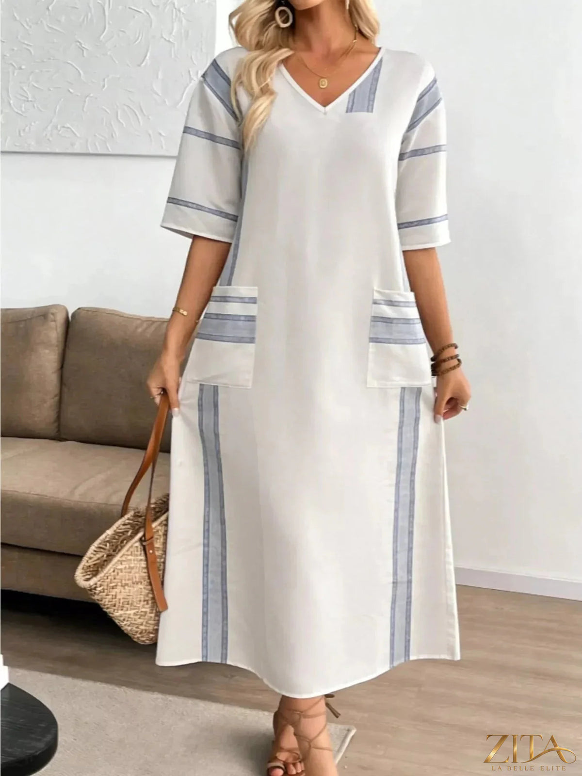 Zita La Belle Elite striped V-neck maxi dress with flowing fabric and bold vertical stripes, perfect for casual or summer wear.