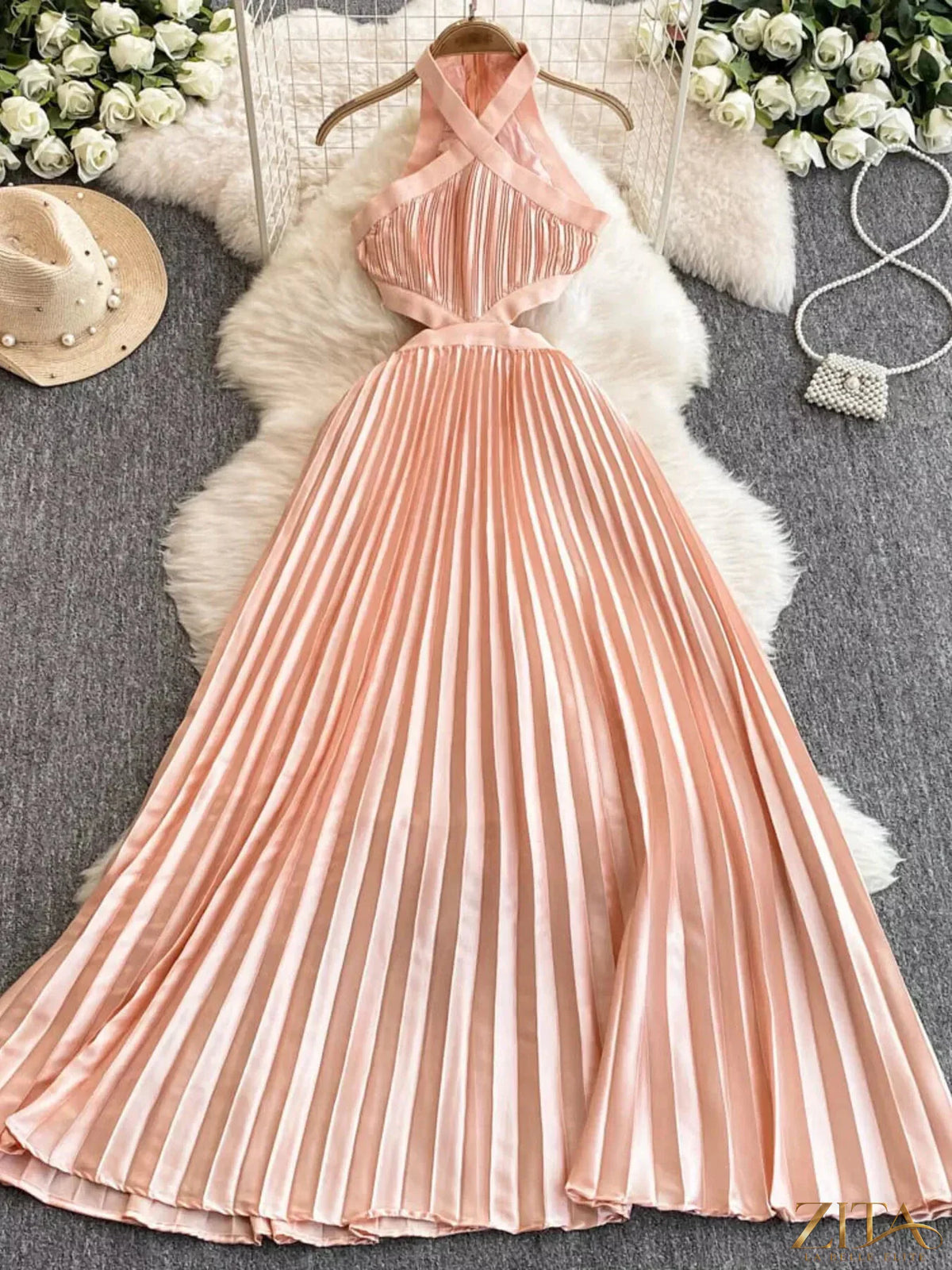 Zita La Belle Elite halter neck pleated maxi dress in flowing fabric, featuring a fitted bodice and elegant pleats.