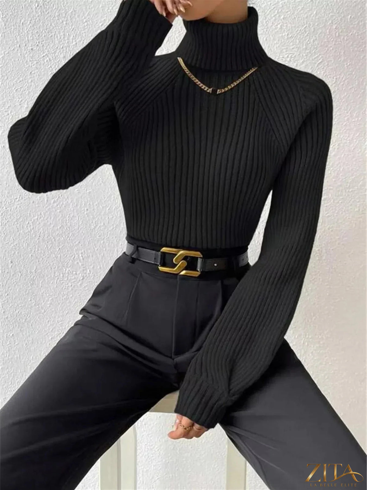 Zita La Belle Elite ribbed knit turtleneck sweater in soft fabric, close-up showing the textured ribbed pattern and high neckline.