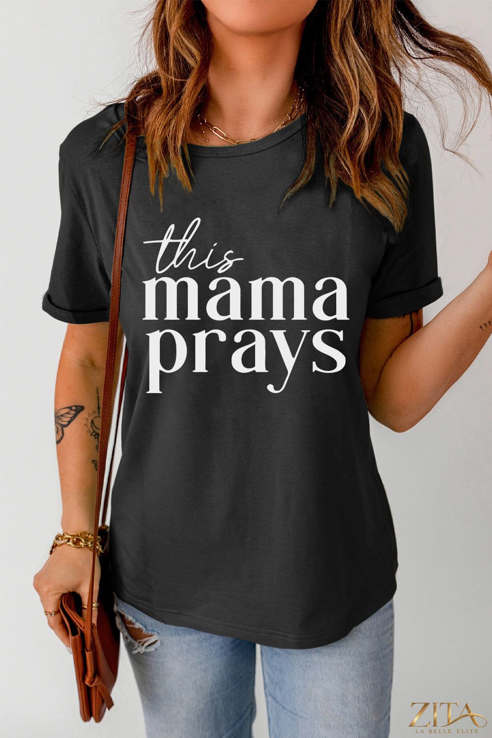 Black graphic T-shirt for moms with "This Mama Prays" slogan, casual fit, trendy design, by Trendsi.