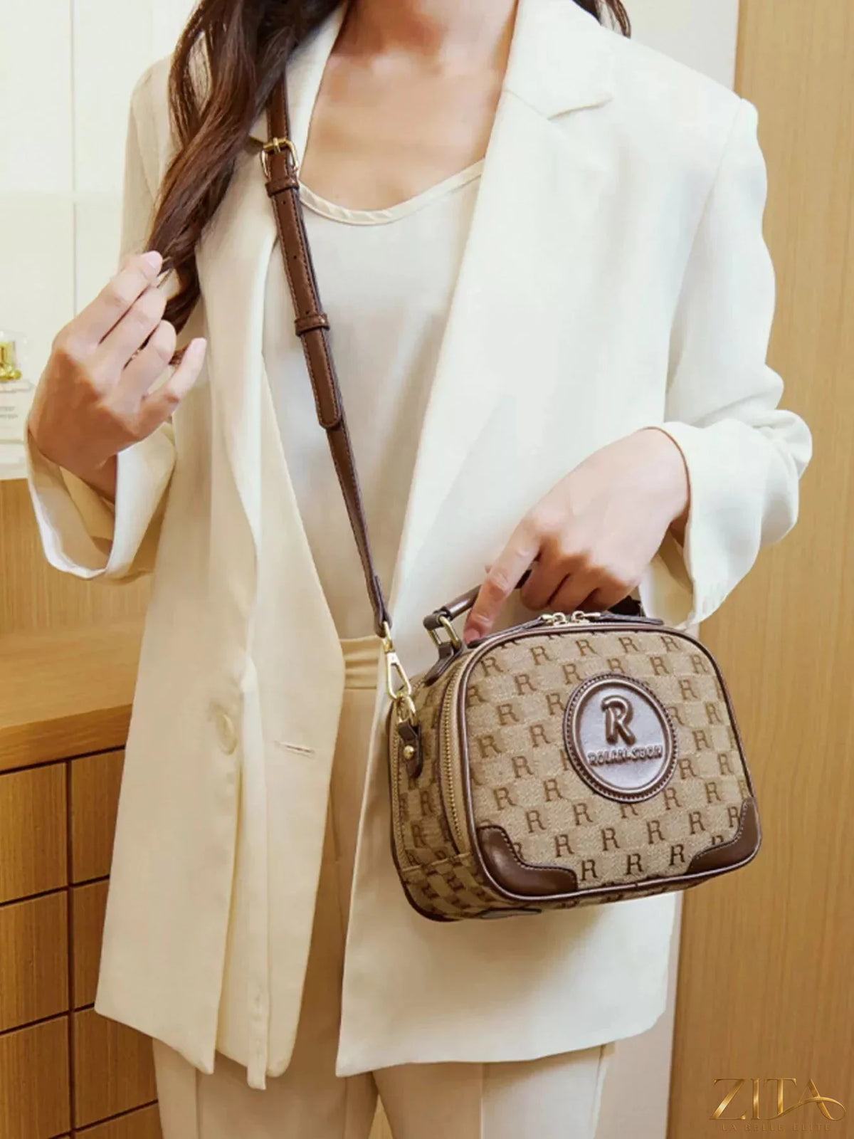 Zita La Belle Elite monogram pattern crossbody handbag with top handle, stylish and compact accessory in the image.