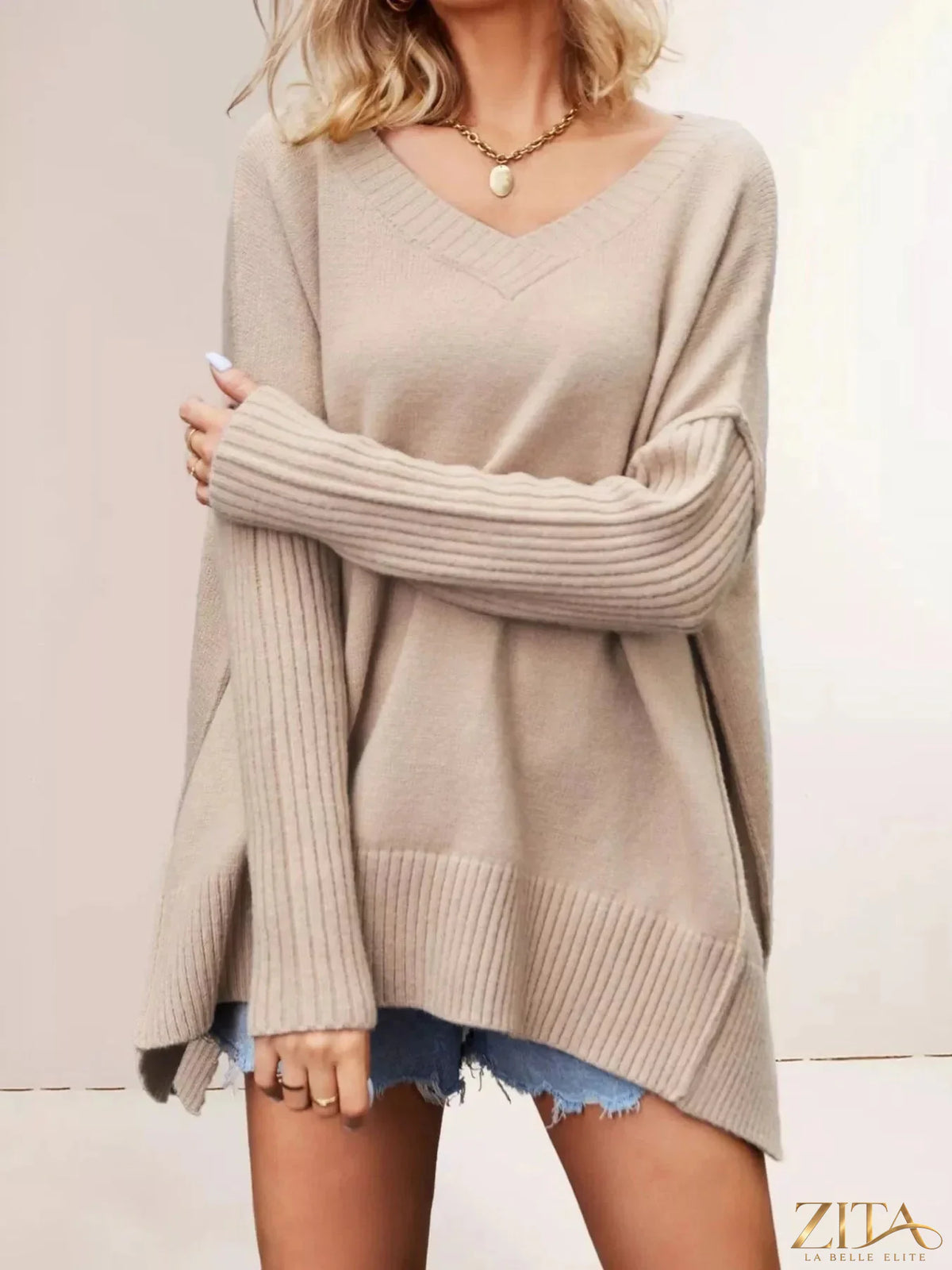 Zita La Belle Elite V-neck ribbed sleeve sweater in soft knit fabric, featuring a fitted silhouette and long sleeves.