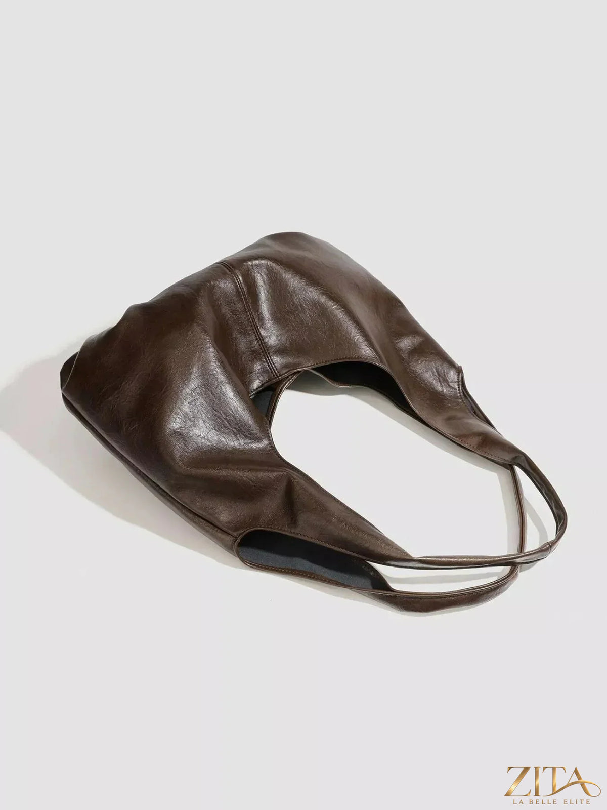 Vintage glossy hobo shoulder bag with matching pouch by Zita La Belle Elite, featuring a sleek design and glossy finish.
