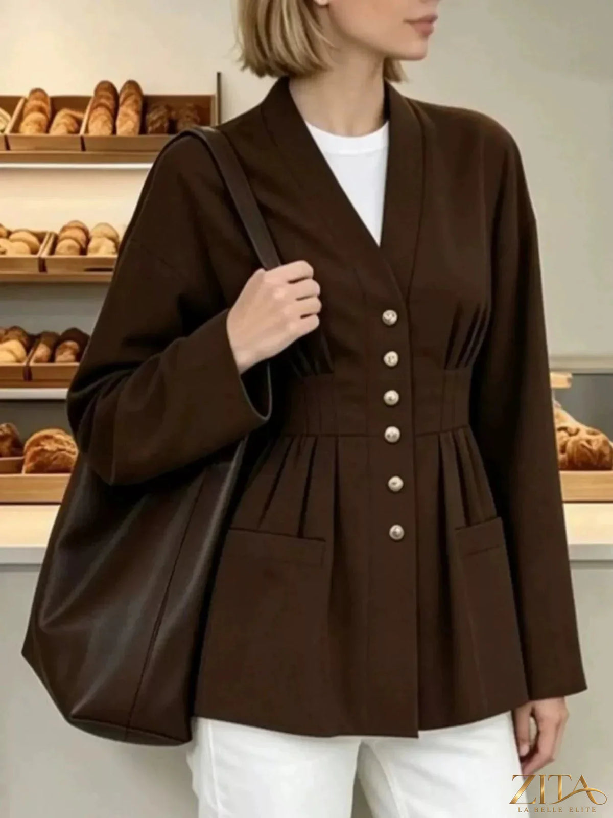 Zita La Belle Elite pleated waist blouse with button detail, featuring a flowy fabric and stylish design.