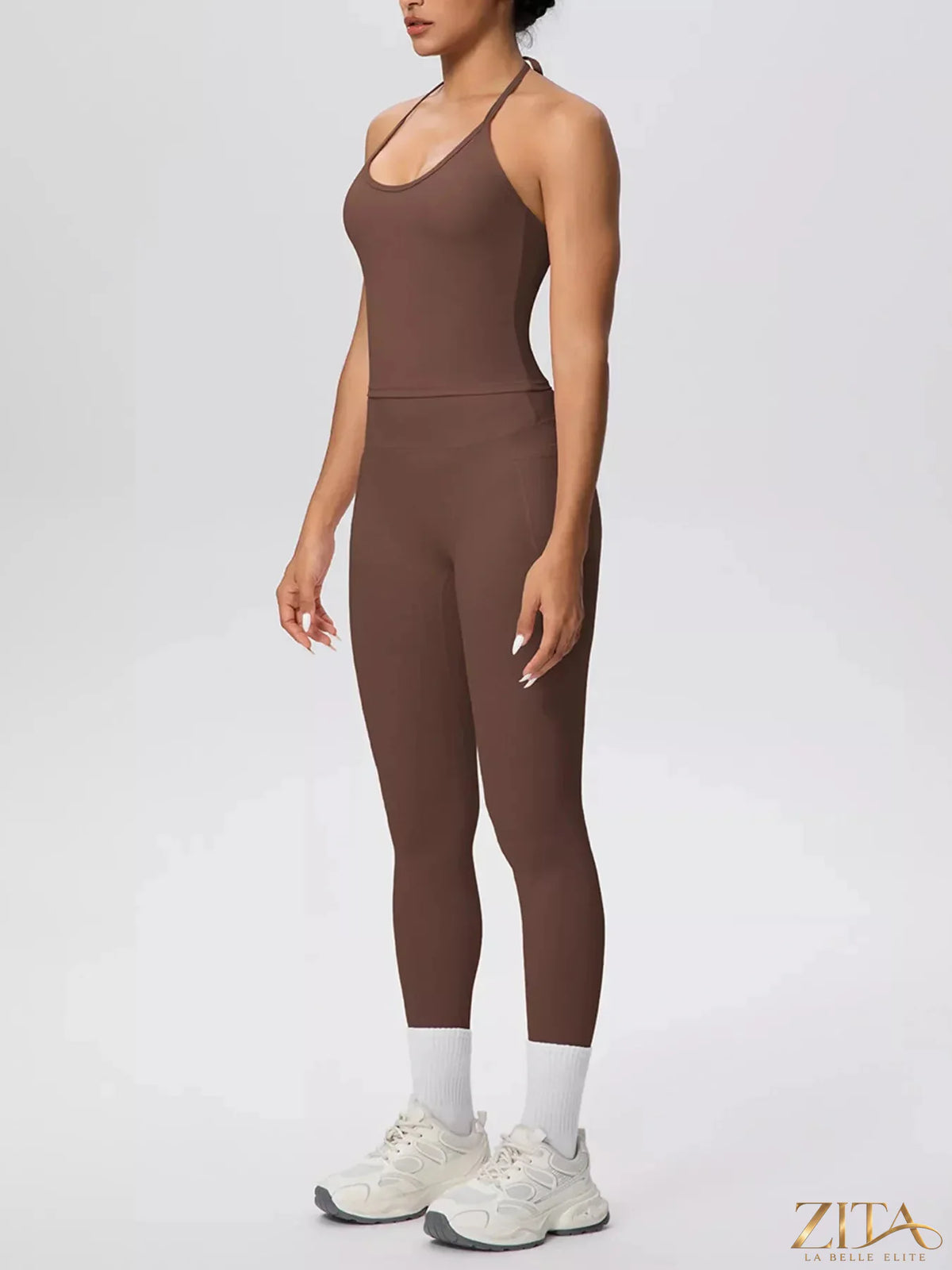 Zita La Belle Elite halter neck cami and high-waisted leggings active set, shown in black, on a model against a white background.