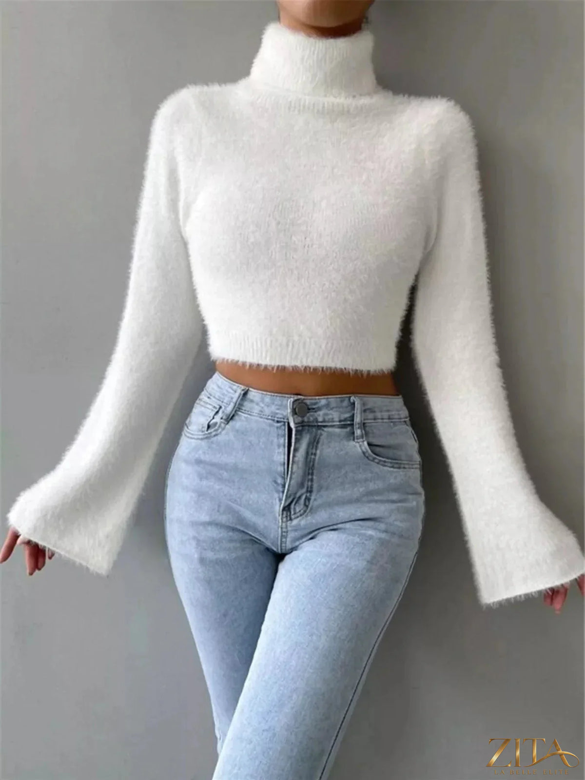 Cream turtleneck flare sleeve sweater by Trendsi featuring a fitted bodice and stylish flare sleeves, perfect for cozy winter wear.