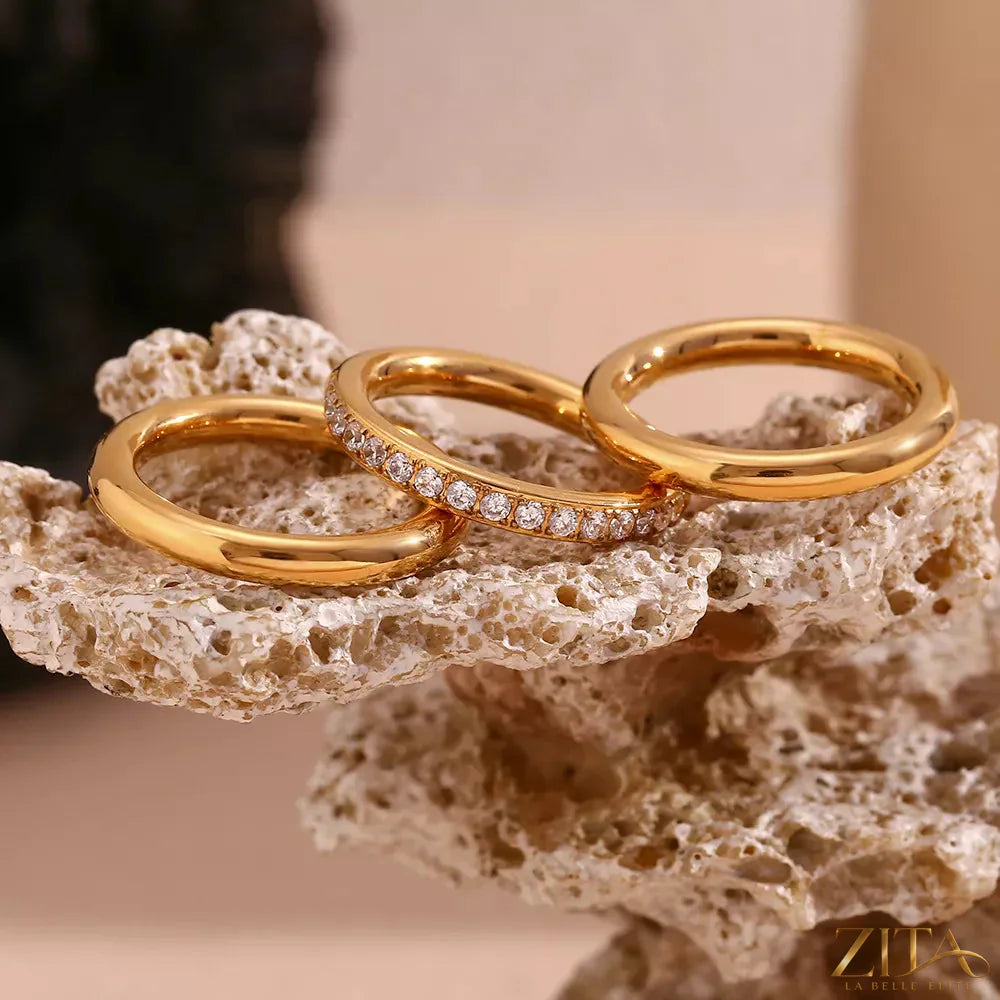 Three-piece stainless steel zircon ring set by Zita La Belle Elite, showing close-up of shiny rings with zircon stones.