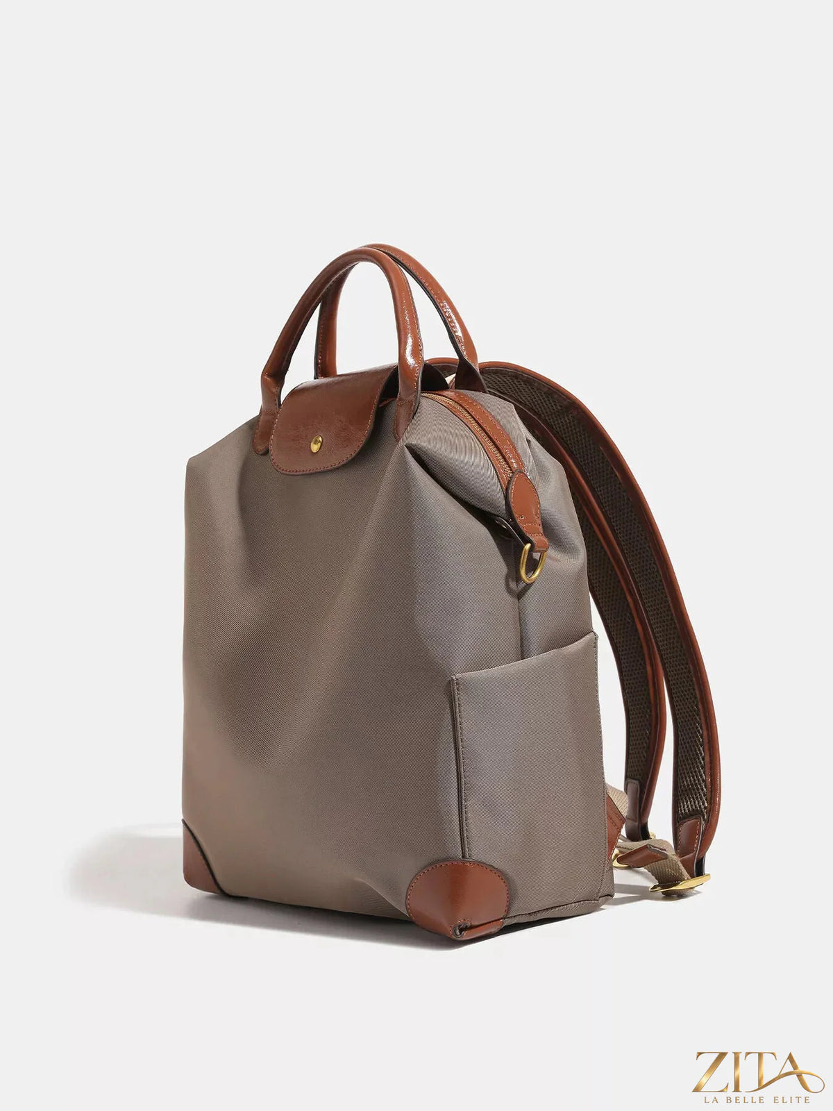 Leather trim backpack bag by Trendsi featuring a sleek design with adjustable straps and multiple compartments.