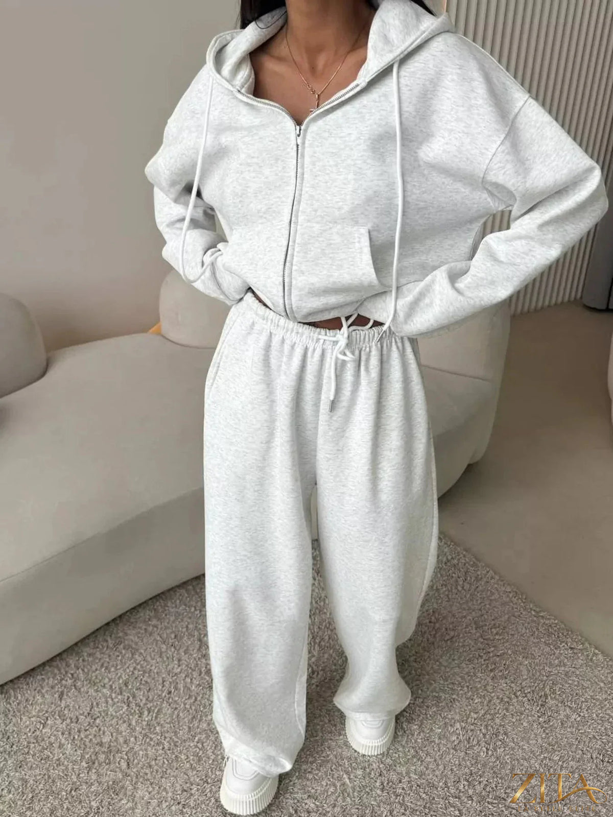 Zita La Belle Elite zip-up hoodie and wide-leg pants set in soft fabric, shown in a stylish, casual outfit.