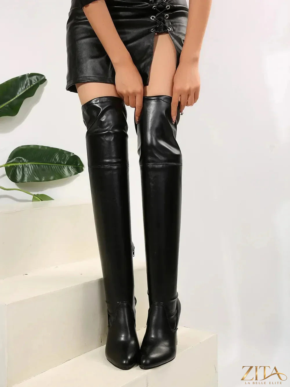 Zita La Belle Elite point toe high heel boots made of black PU leather with sleek design and stiletto heel.