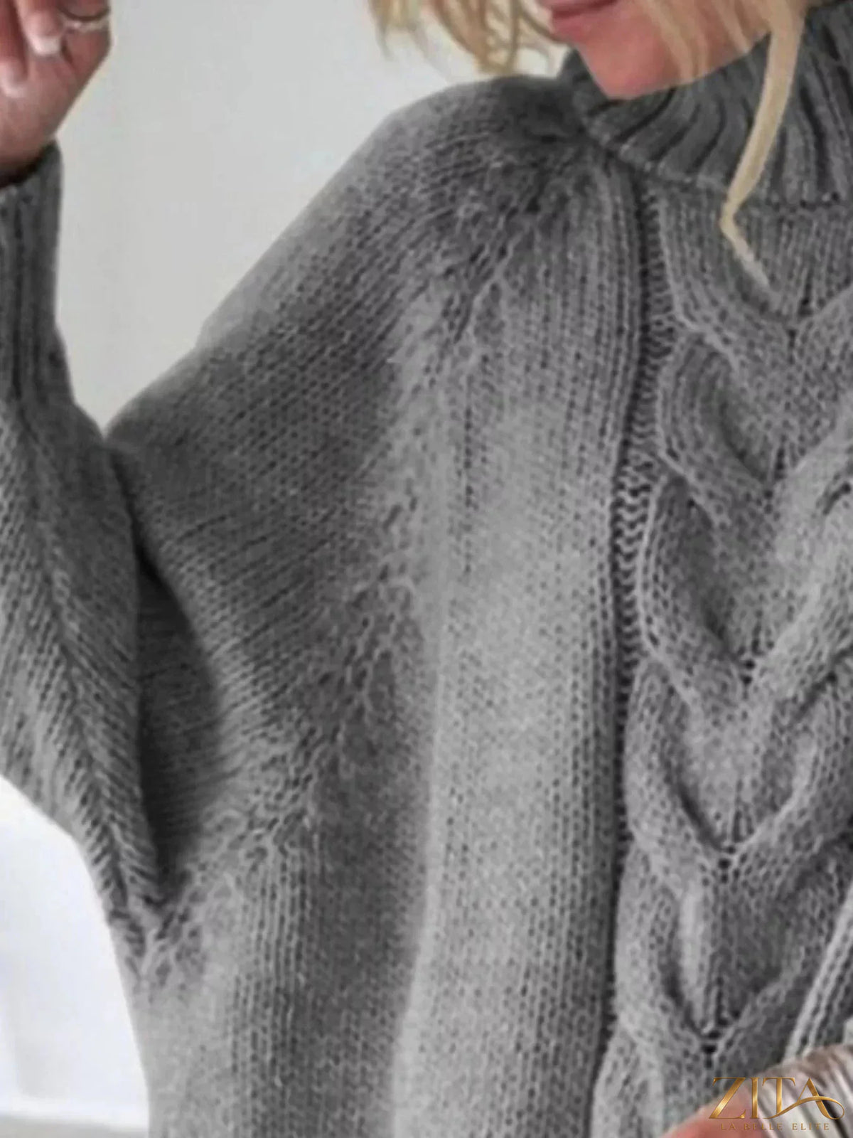 Zita La Belle Elite cable-knit long sleeve sweater in neutral tone, featuring a textured knit pattern and classic fit.