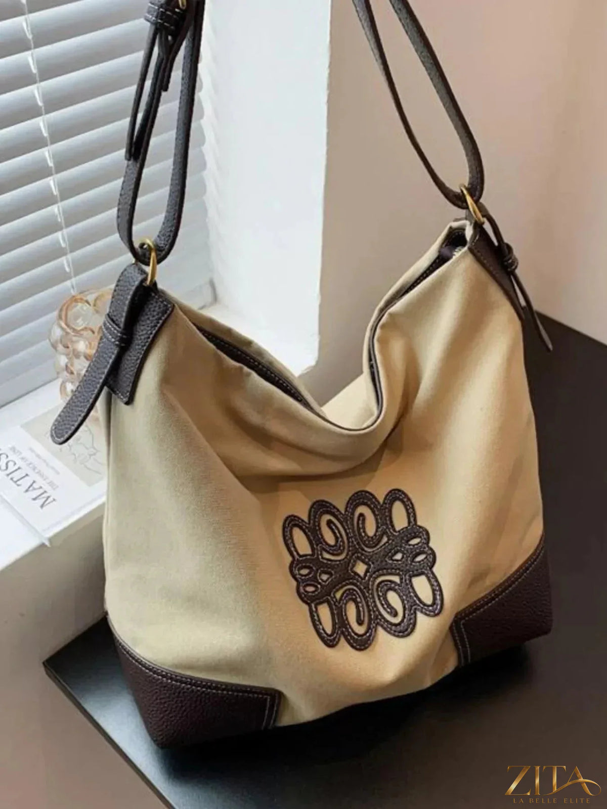 Embroidered canvas tote bag by Zita La Belle Elite with colorful floral embroidery and sturdy handles, suitable for daily use.
