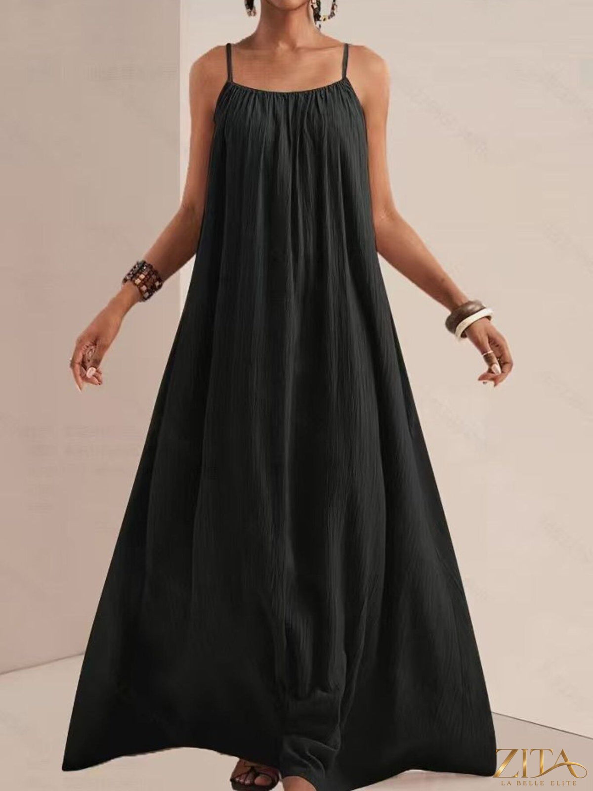 Flowy spaghetti strap maxi dress by Zita La Belle Elite, featuring lightweight fabric and elegant design.