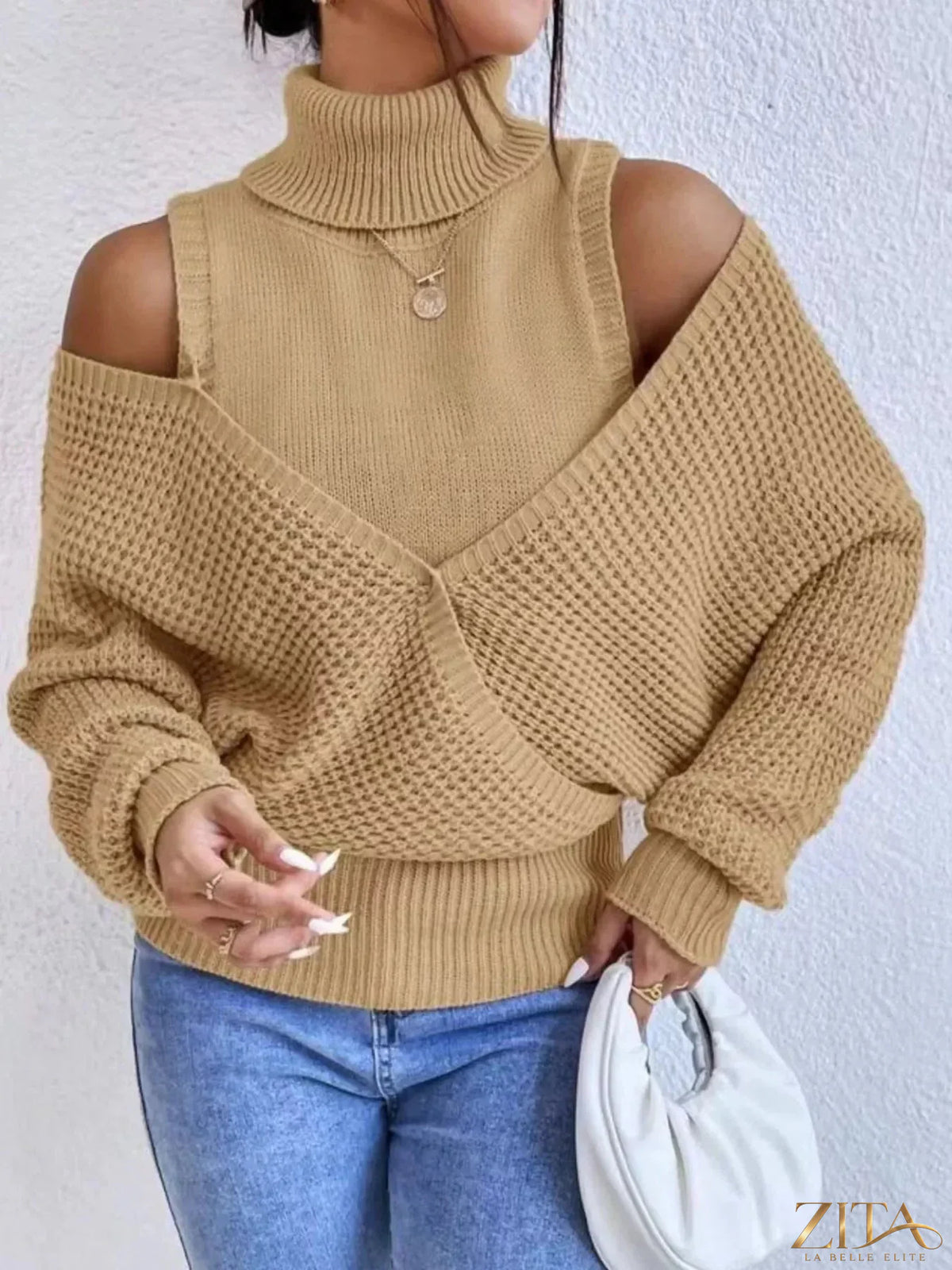 Waffle knit cold shoulder turtleneck sweater by Trendsi featuring a cozy design, turtleneck collar, and stylish cold shoulder cutouts.