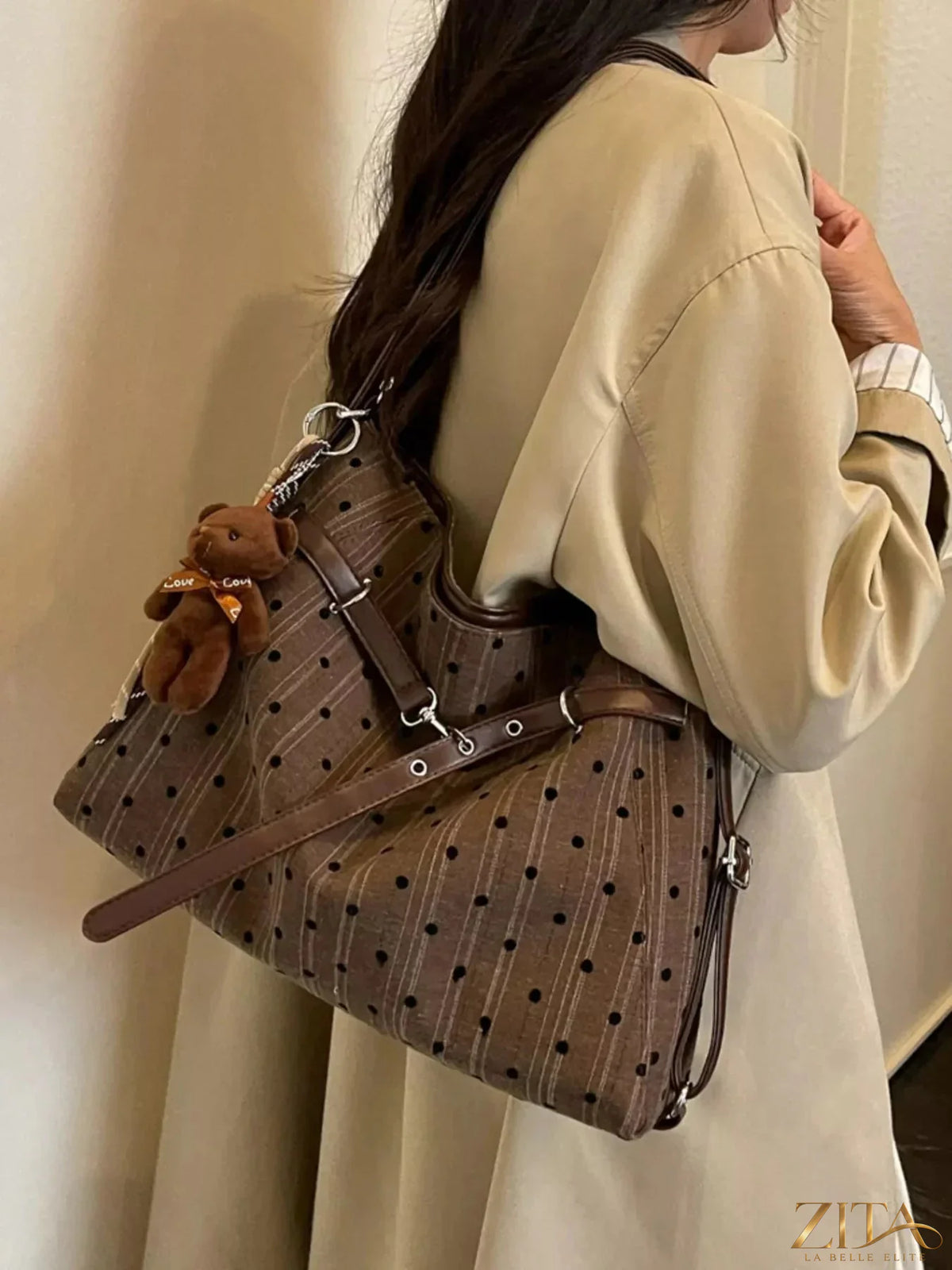 Zita La Belle Elite polka dot shoulder bag with a black and white dotted fabric, adjustable strap, and stylish design.