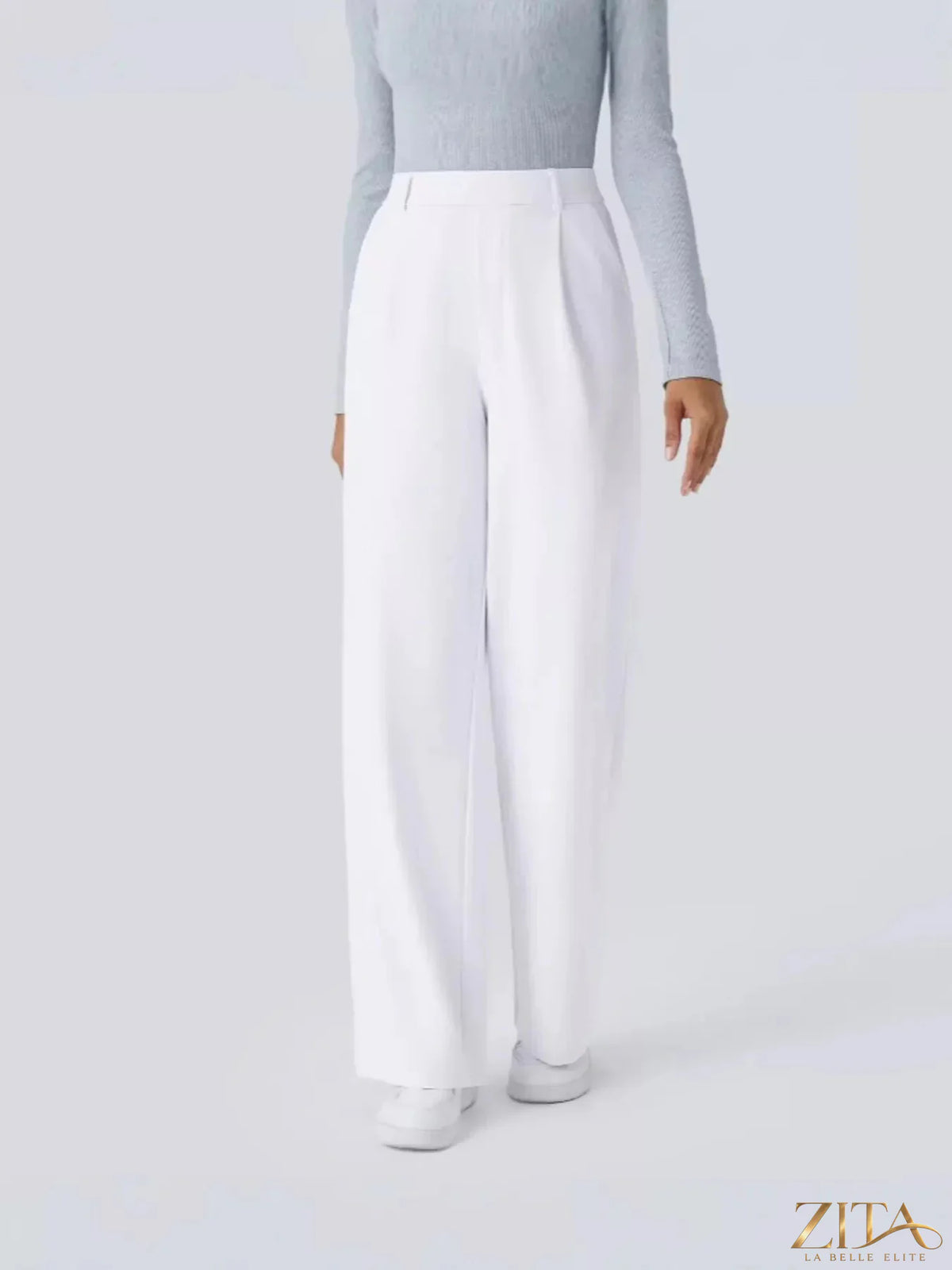 Zita La Belle Elite wide leg pants in a flowing fabric, featuring a high waist and relaxed fit, shown in a neutral color.
