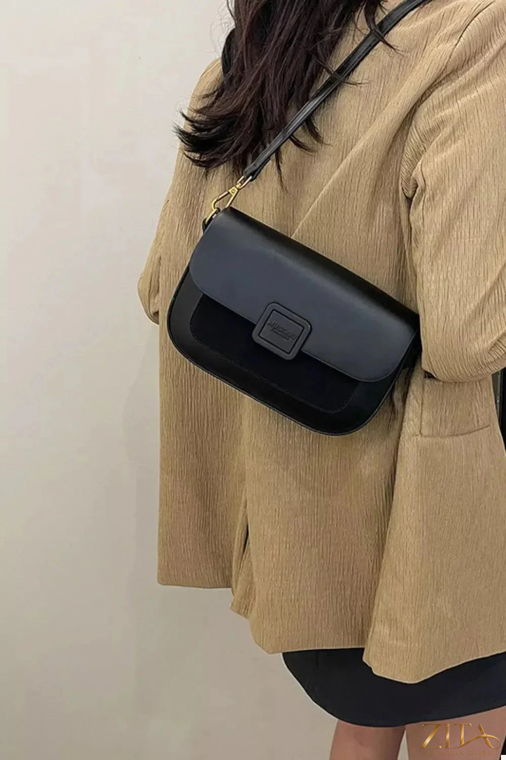 Zita La Belle Elite flap closure shoulder bag featuring a sleek design and adjustable strap on a neutral background.