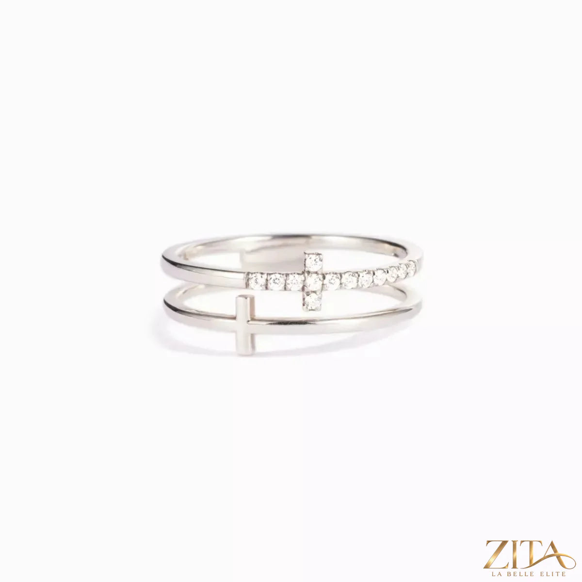 Zita La Belle Elite double band cross ring featuring intertwined silver bands and a cross design, close-up view of the jewelry.