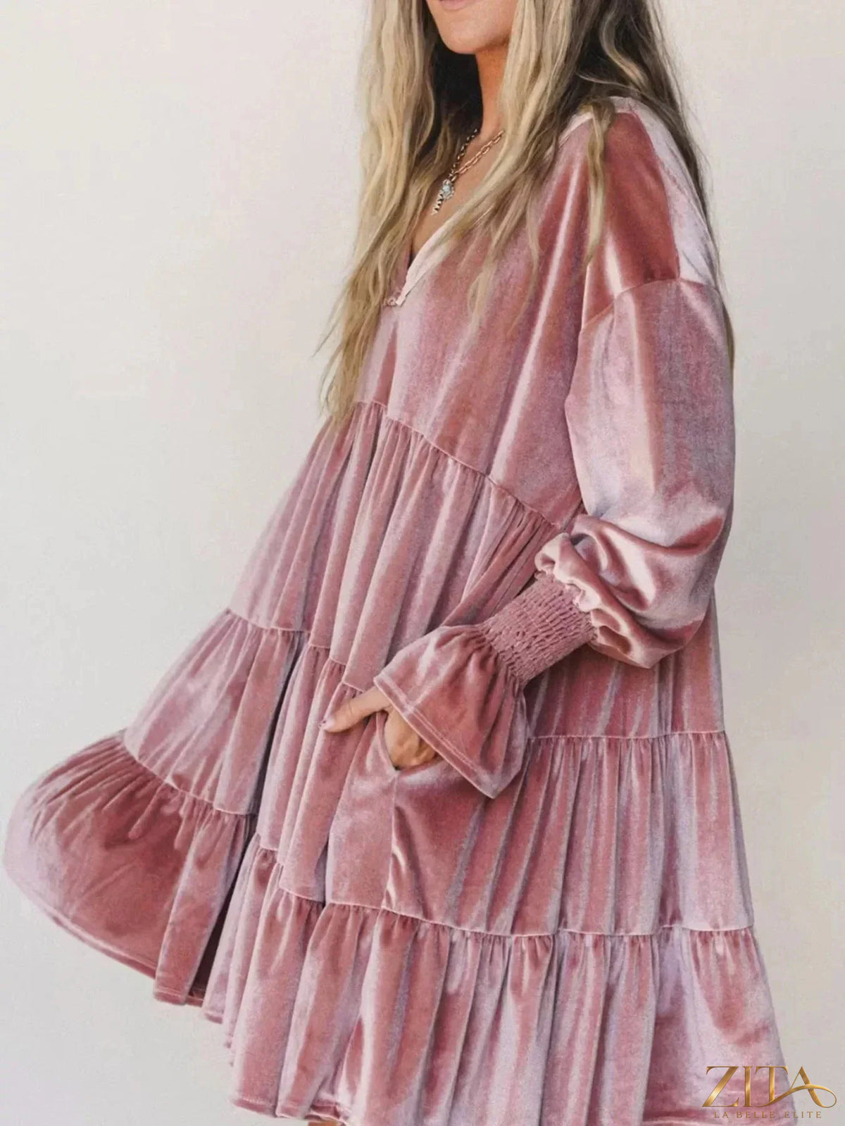 Velvet tiered mini dress with balloon sleeves by Zita La Belle Elite, showing the flowing fabric and stylish design.