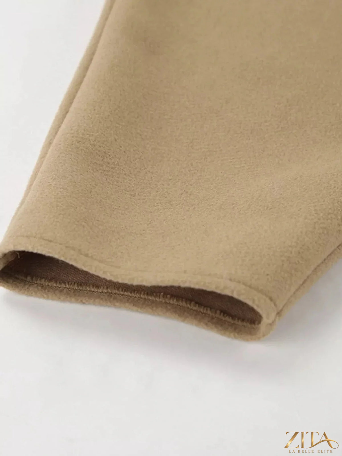 Zita La Belle Elite oversized lapel collar button-down coat in neutral fabric, displayed on a hanger with a soft background.