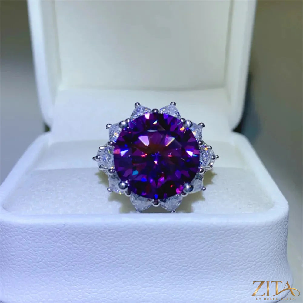 Sterling silver flower-shaped ring with a 10-carat moissanite gemstone, showcasing intricate floral design and sparkling brilliance.