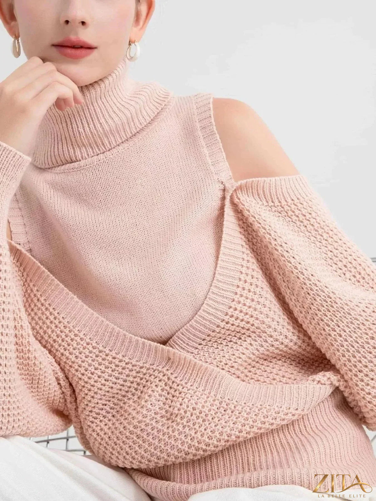Waffle knit cold shoulder turtleneck sweater by Trendsi, featuring a cozy design with shoulder cutouts and a turtleneck in soft fabric.