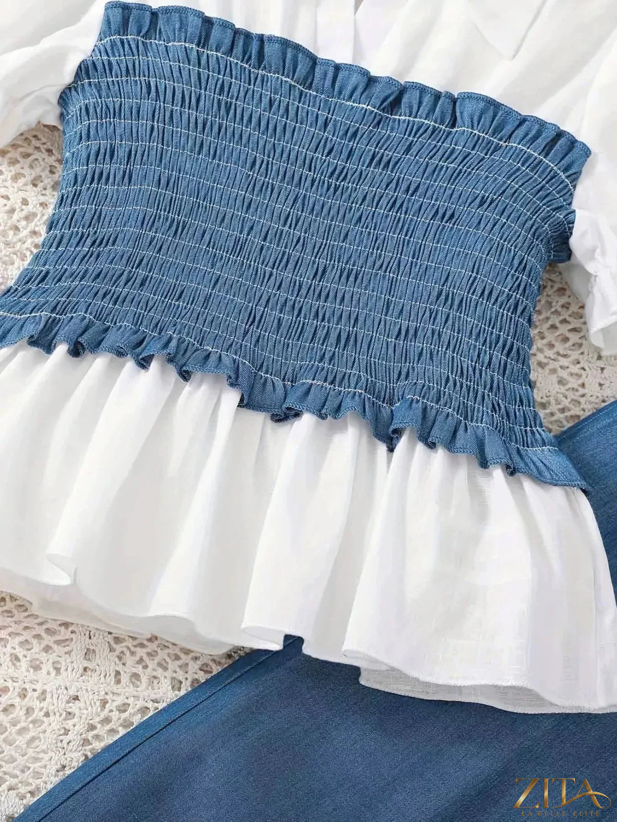 Children's smocked blouse and wide-leg pants set by Zita La Belle Elite, featuring a cute embroidered blouse and comfortable loose pants.