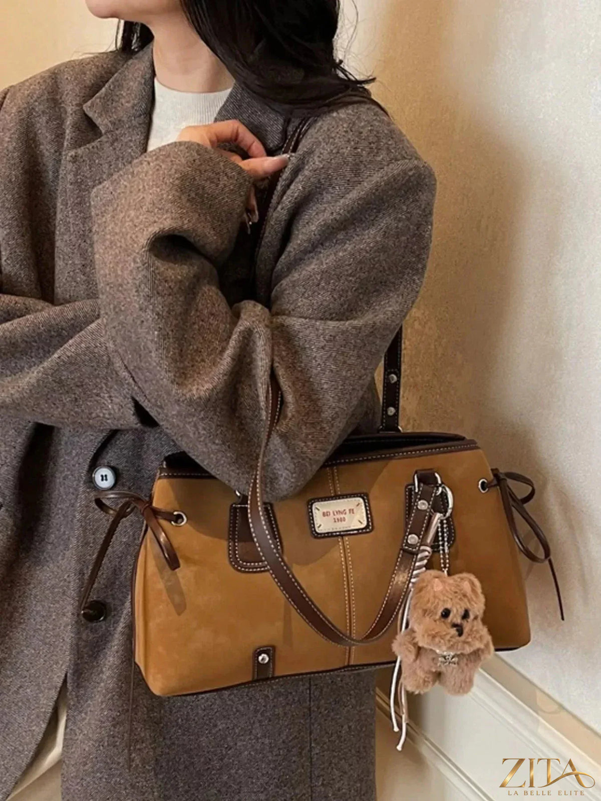 Zita La Belle Elite side tie shoulder bag in stylish design with adjustable straps and spacious interior.