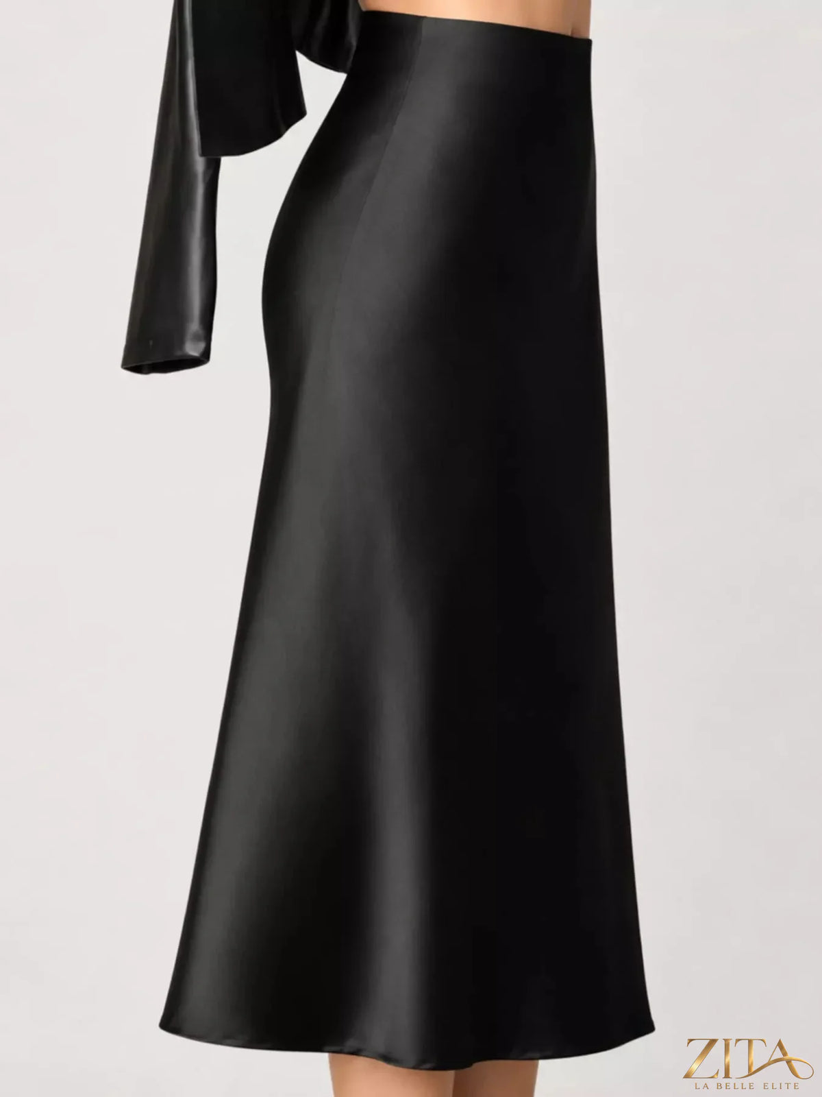 High-waisted satin midi skirt in soft sheen fabric, stylish and elegant, shown in a versatile design with a flowing silhouette.