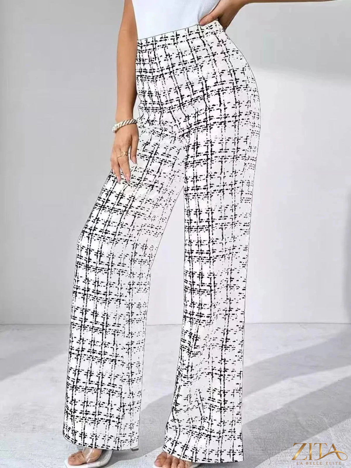 Zita La Belle Elite plaid wide-leg pants with a high waist and relaxed fit, featuring a classic checkered pattern and flowing fabric.
