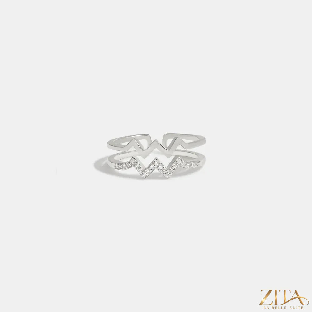 Zita La Belle Elite wave-shaped open ring with inlaid zircon stones, elegant jewelry design, shown on a white background.