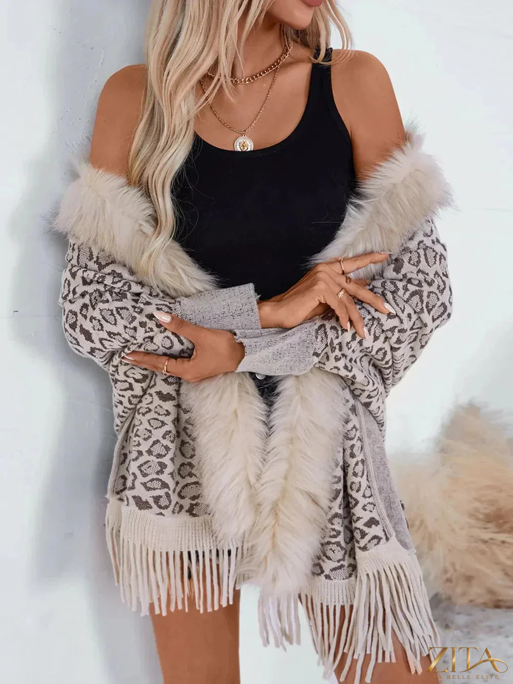 Leopard print fringe open front long sleeve poncho by Trendsi, featuring a stylish and cozy design with fringe details.