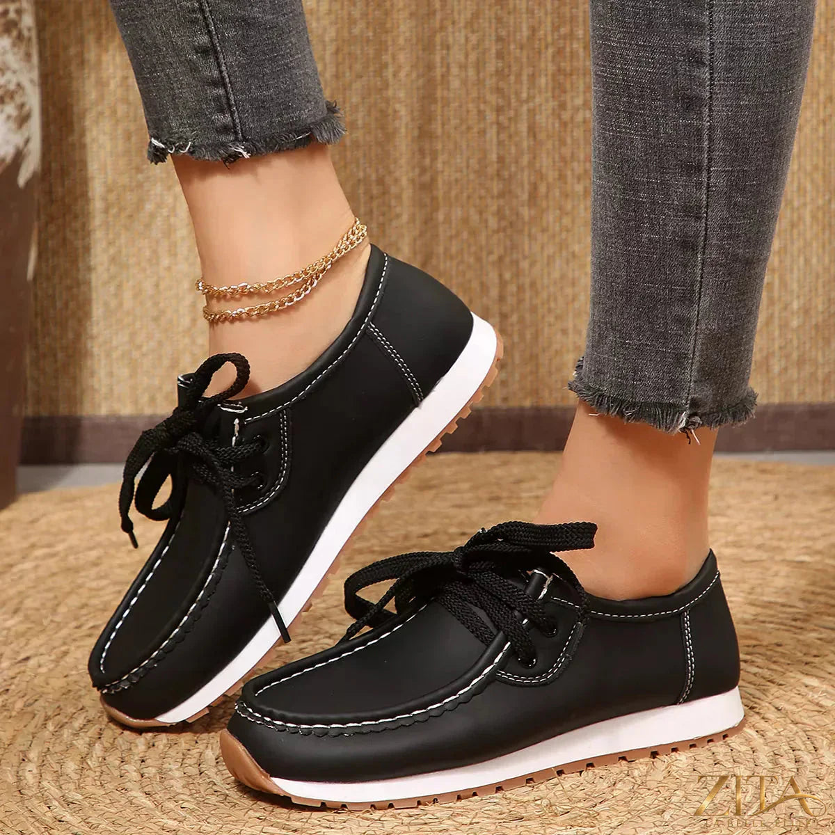 Zita La Belle Elite round toe lace-up sneakers with white soles and stylish design, shown from a side angle.