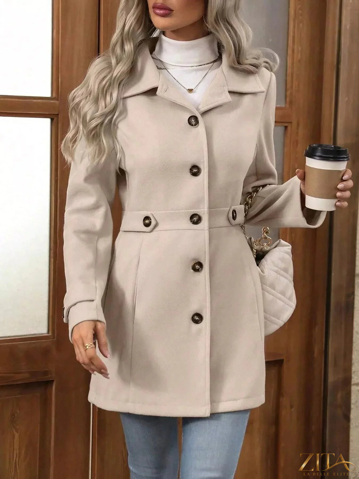 Zita La Belle Elite single-breasted long sleeve coat in neutral fabric, shown on a hanger with a tailored fit and classic design.
