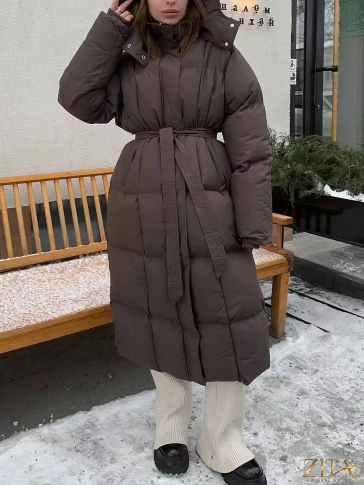 Longline padded winter coat with belt from Zita La Belle Elite, featuring a warm, insulated design and a stylish belt detail.