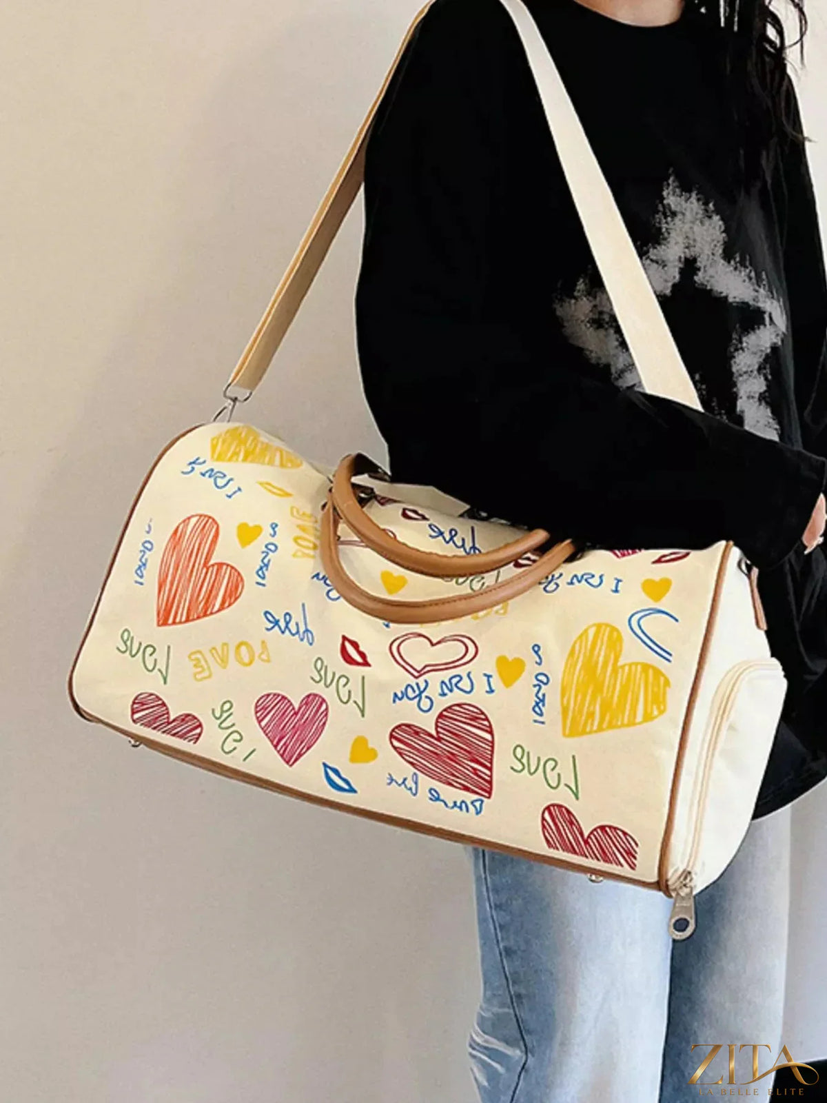 Printed Zita La Belle Elite duffel bag with adjustable strap, showing colorful floral design and sturdy handles for travel or gym use.