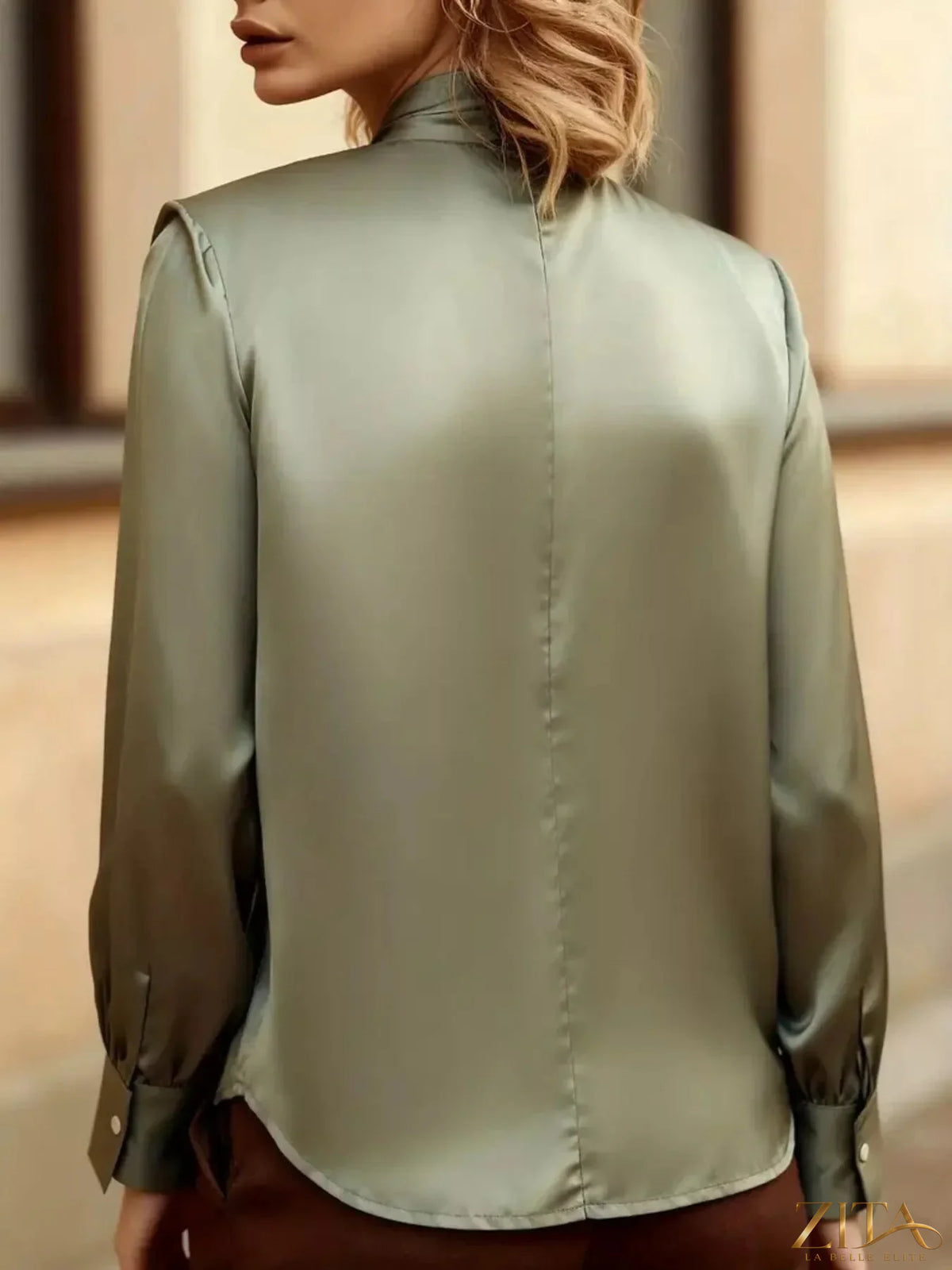 Zita La Belle Elite satin cutout front blouse featuring a stylish design with a satin finish and elegant front cutouts.