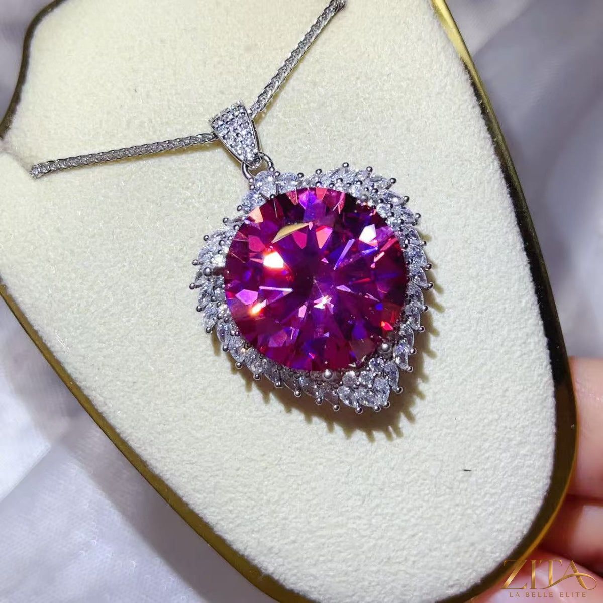 Sterling silver pendant necklace with a 20-carat moissanite gemstone, featuring an elegant, sparkling jewelry design.