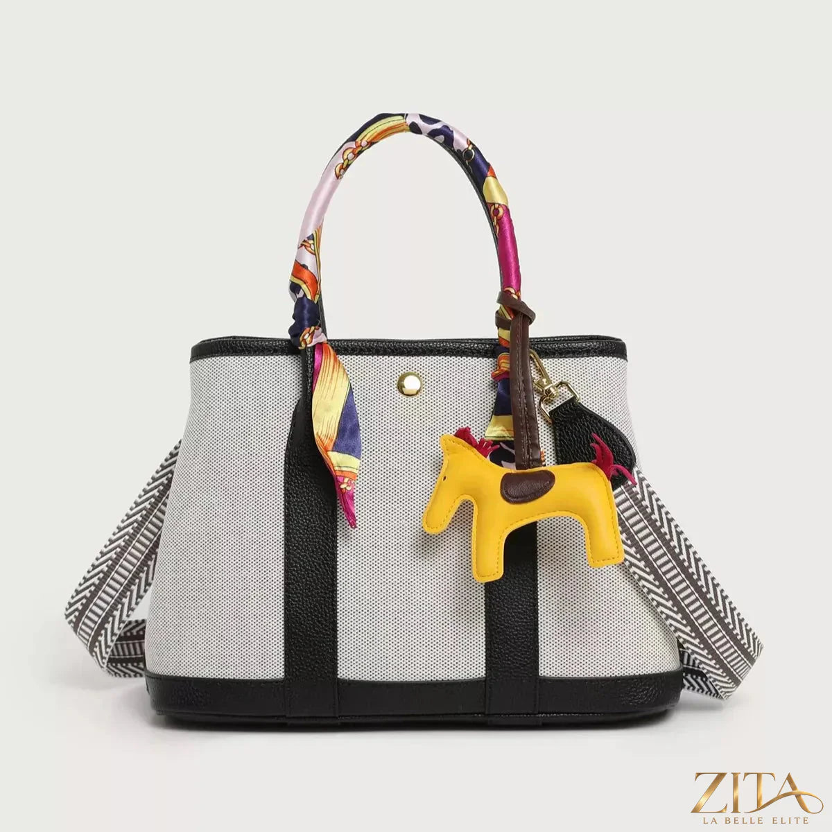Zita La Belle Elite canvas handbag with silk scarf and horse charm, showcasing elegant accessories and detailed craftsmanship.