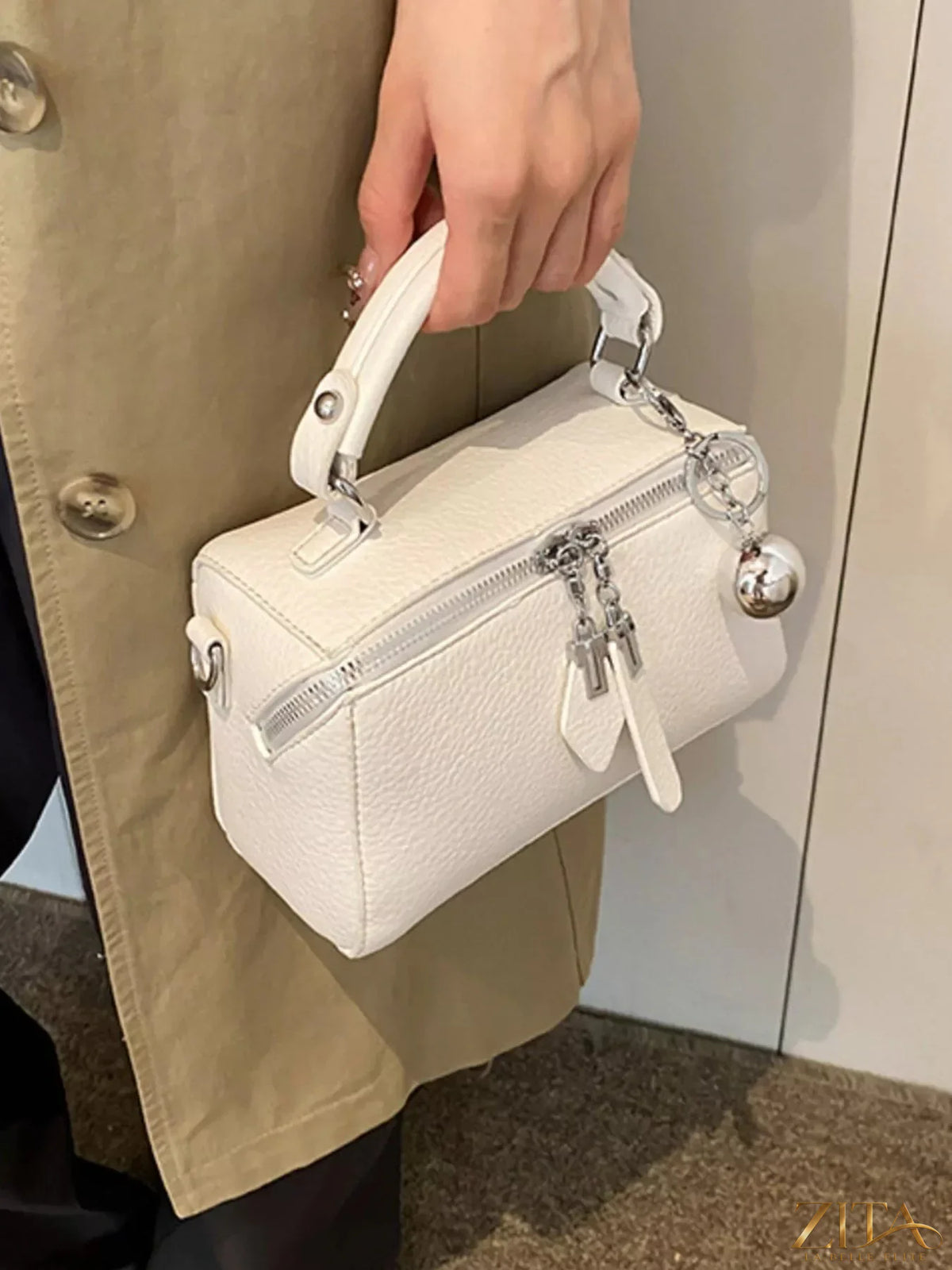 Textured leather handbag from Trendsi, showcasing a stylish, durable design with top handles and a spacious interior.