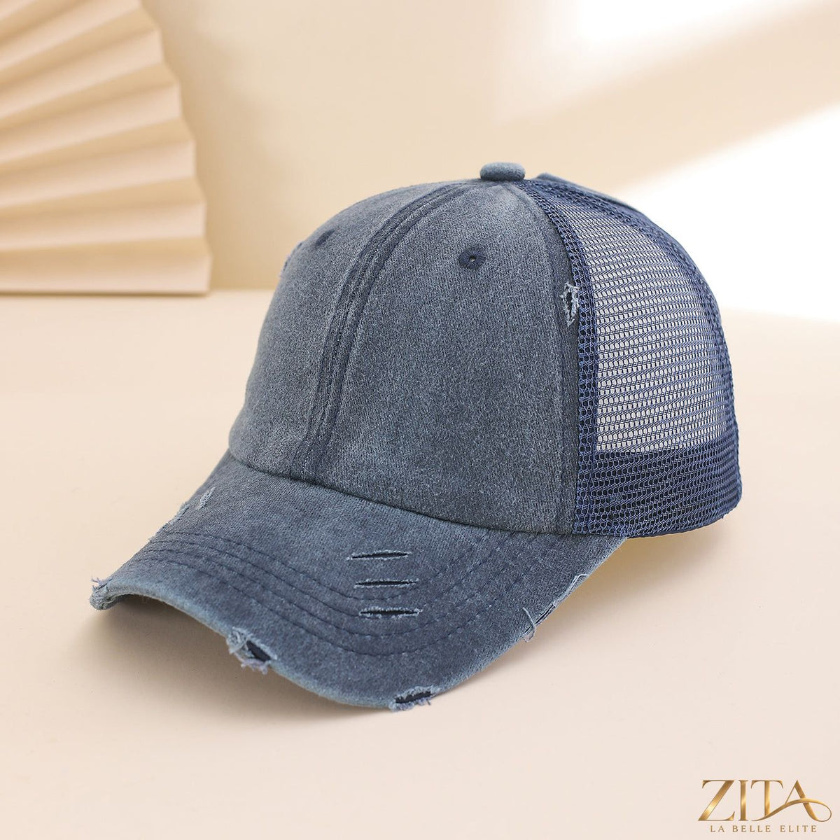 Distressed washed mesh baseball cap by Zita La Belle Elite, casual hat with breathable mesh panels and a worn, vintage look.