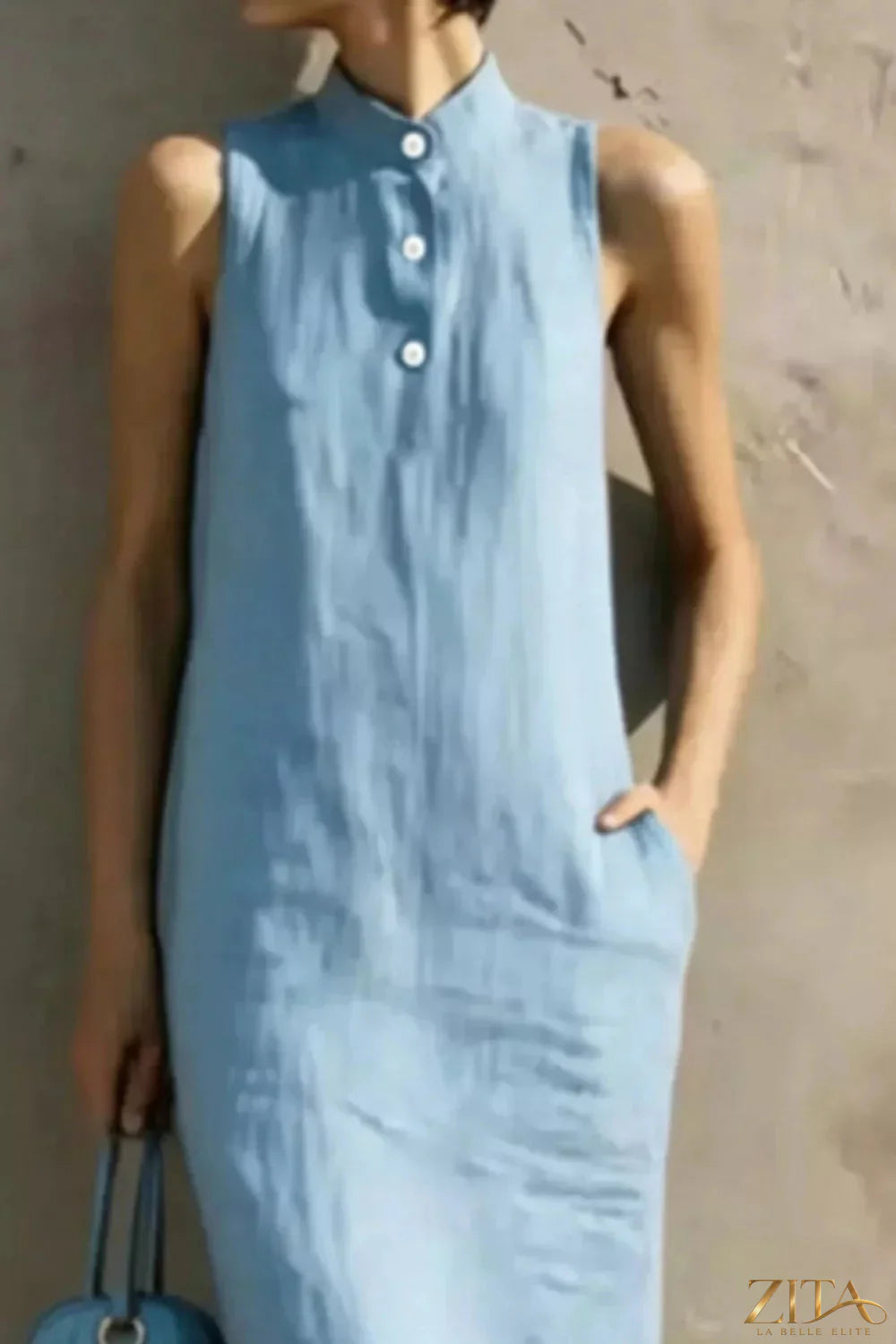 Casual sleeveless midi dress by Zita La Belle Elite with button details, flowing fabric, and a relaxed fit.