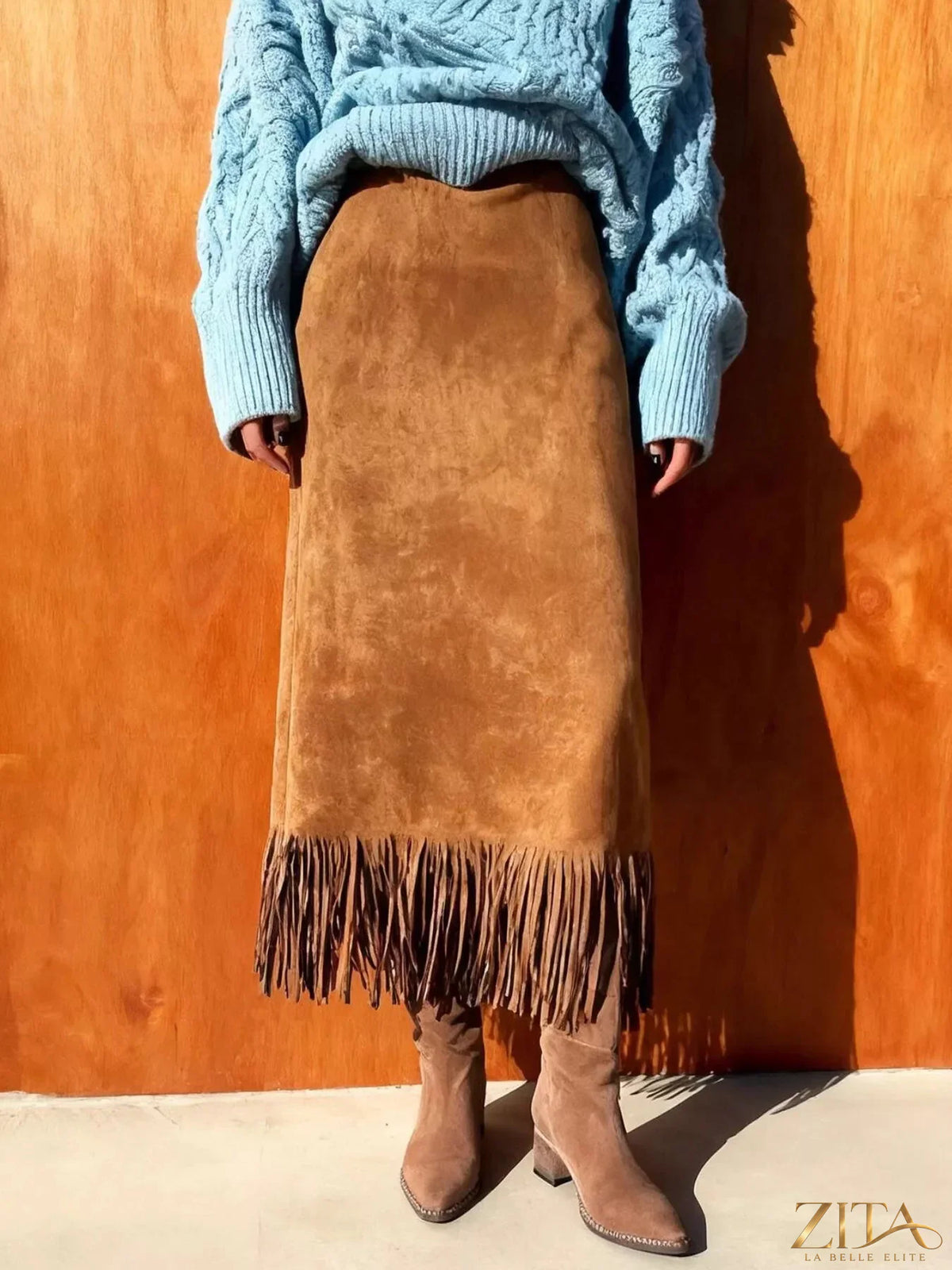 High-waisted suede fringe midi skirt by Trendsi, showcasing a stylish, flowing design with layered fringe details.