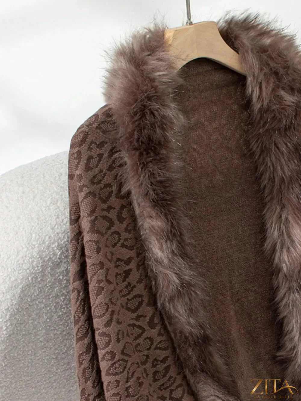 Leopard print fringe open front long sleeve poncho with tassel details, stylish and cozy, by Trendsi.